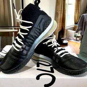 UA Project Rock Collection black tennis shoes